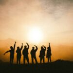 Family in silhoutte against the sun