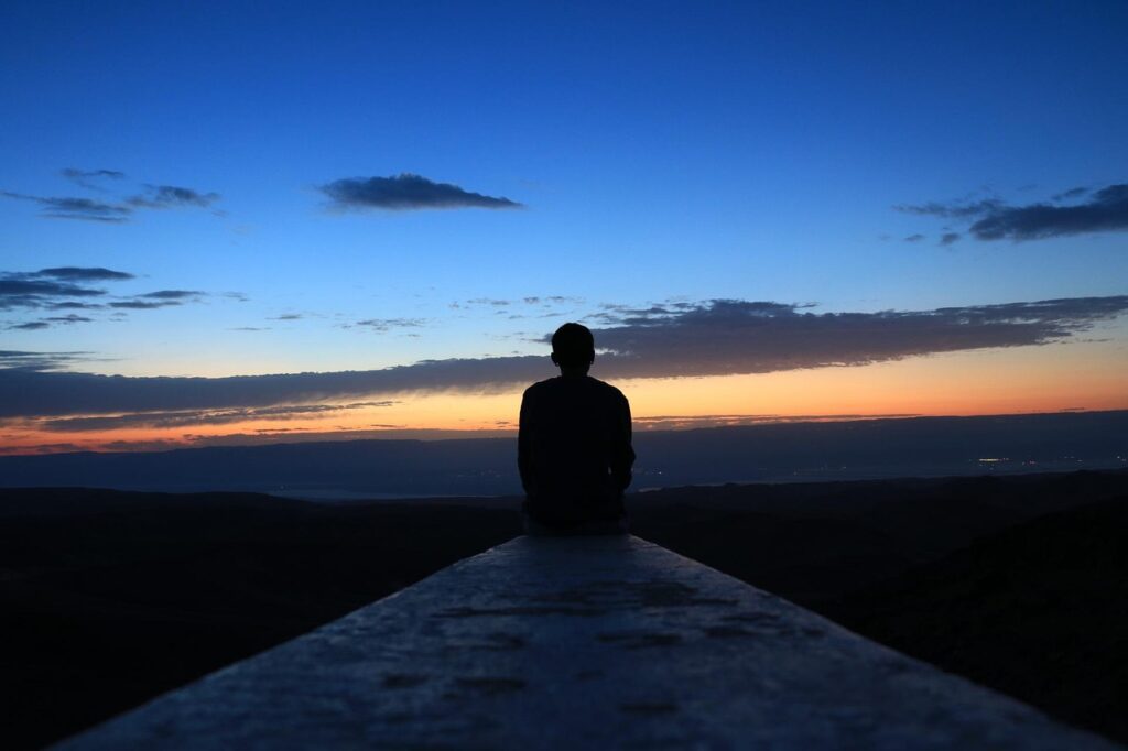 Man taking a rest day and enjoying the sunset